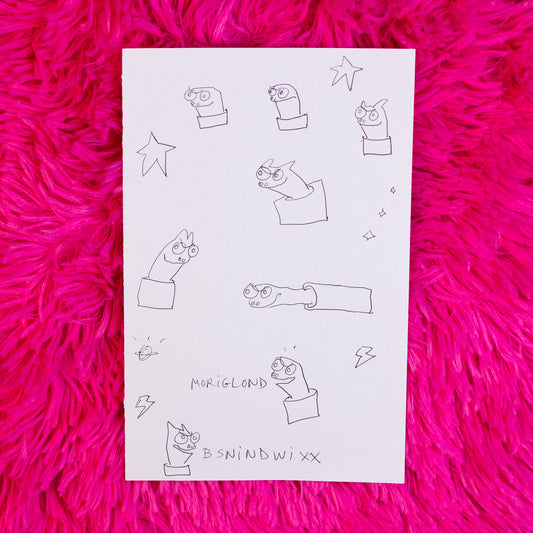 Sheet of paper with black line art on a pink textured surface